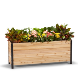 A wooden planter box measuring 18 inches wide, 60 inches long, and 24 inches tall, filled with colorful flowers.