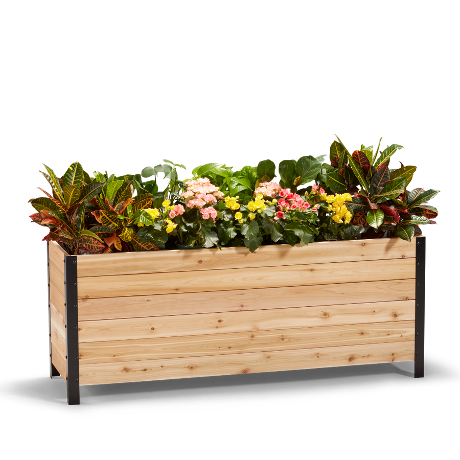 A wooden planter box measuring 18 inches wide, 60 inches long, and 24 inches tall, filled with colorful flowers.